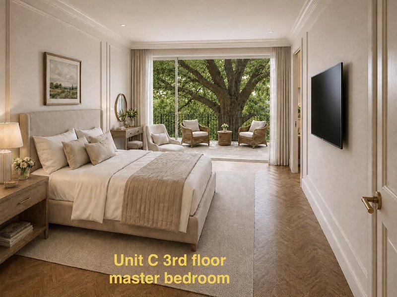 Unit C third-floor master bedroom opening to tree balcony