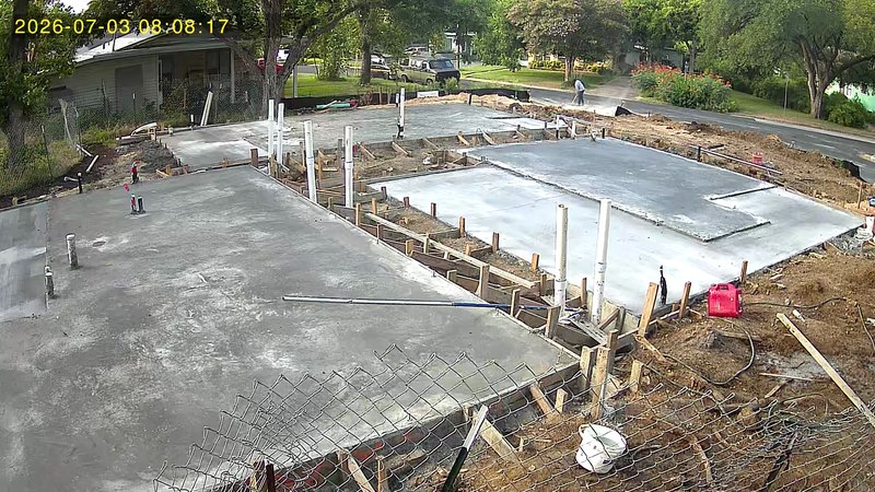 The poured foundation slab at 1708 Collier on July 3, 2026
