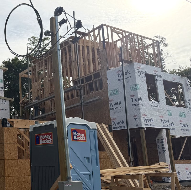 Two homes wrapped at 1708 Collier with site power connected, October 2026