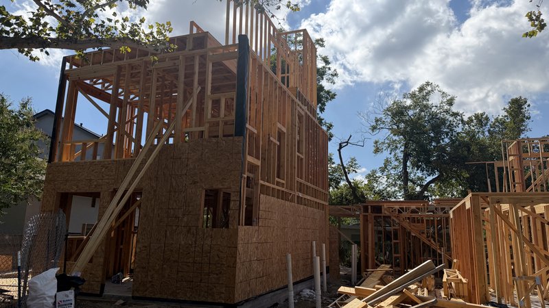 OSB sheathing wrapping the first two floors of Home 1