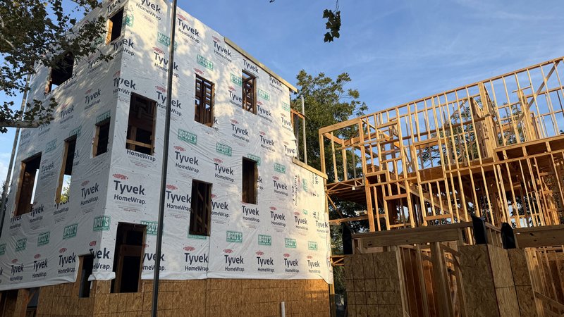 Close view of the wrapped corner with window openings ready for units